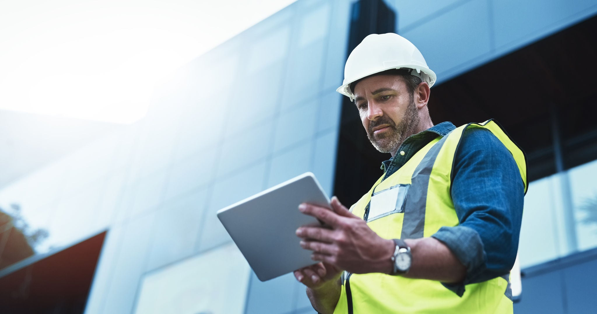 Shot of a engineer using a digital tablet on a construction site